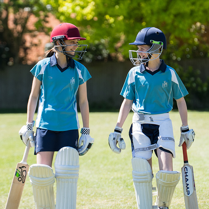 Two pupils in Cricket gear