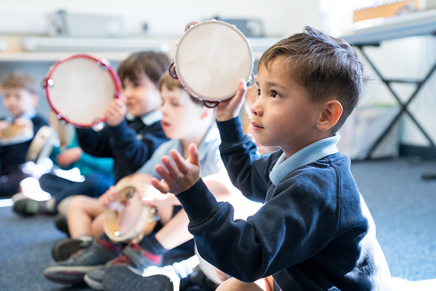 Nursery child in music class