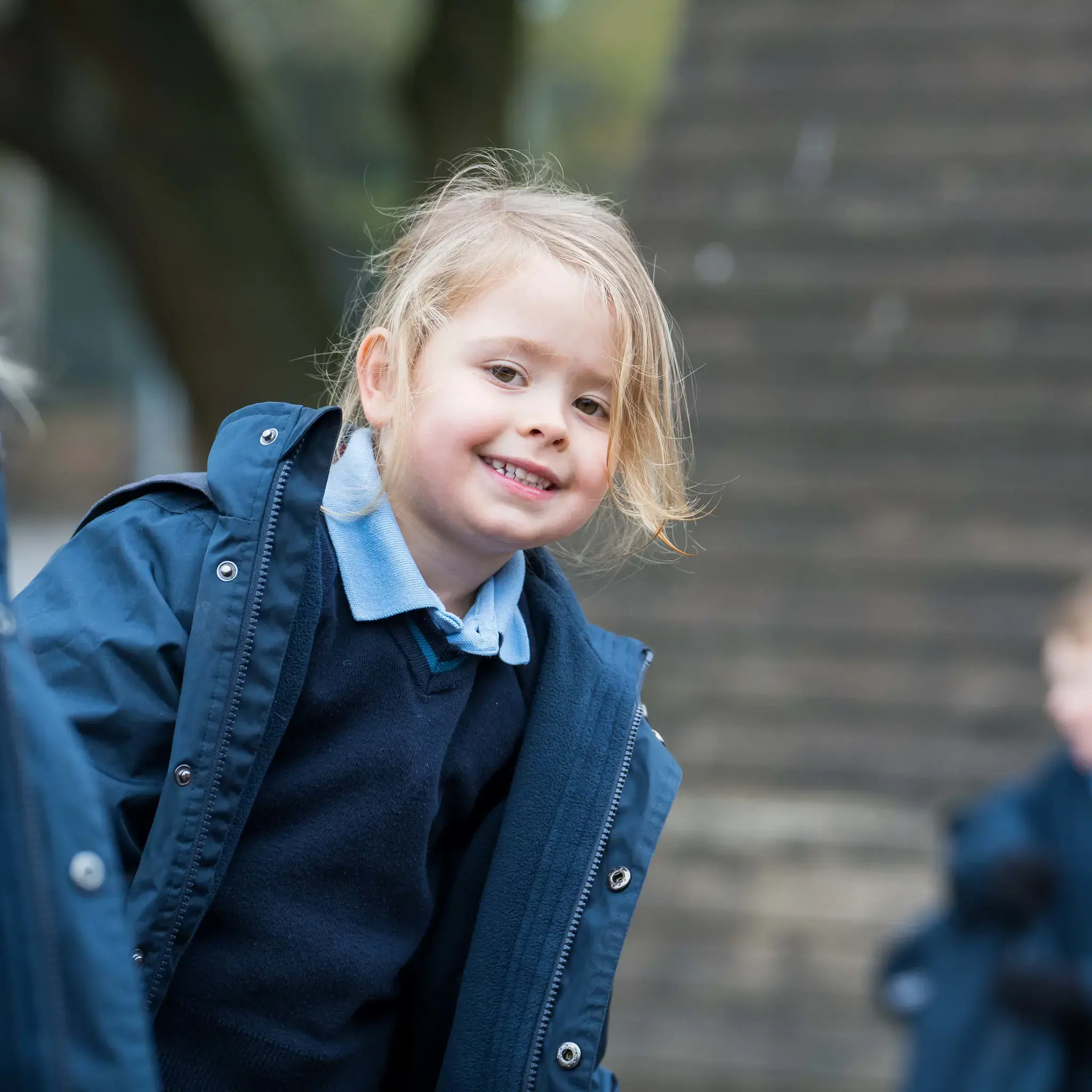 Girl in playground at Woodham Rise