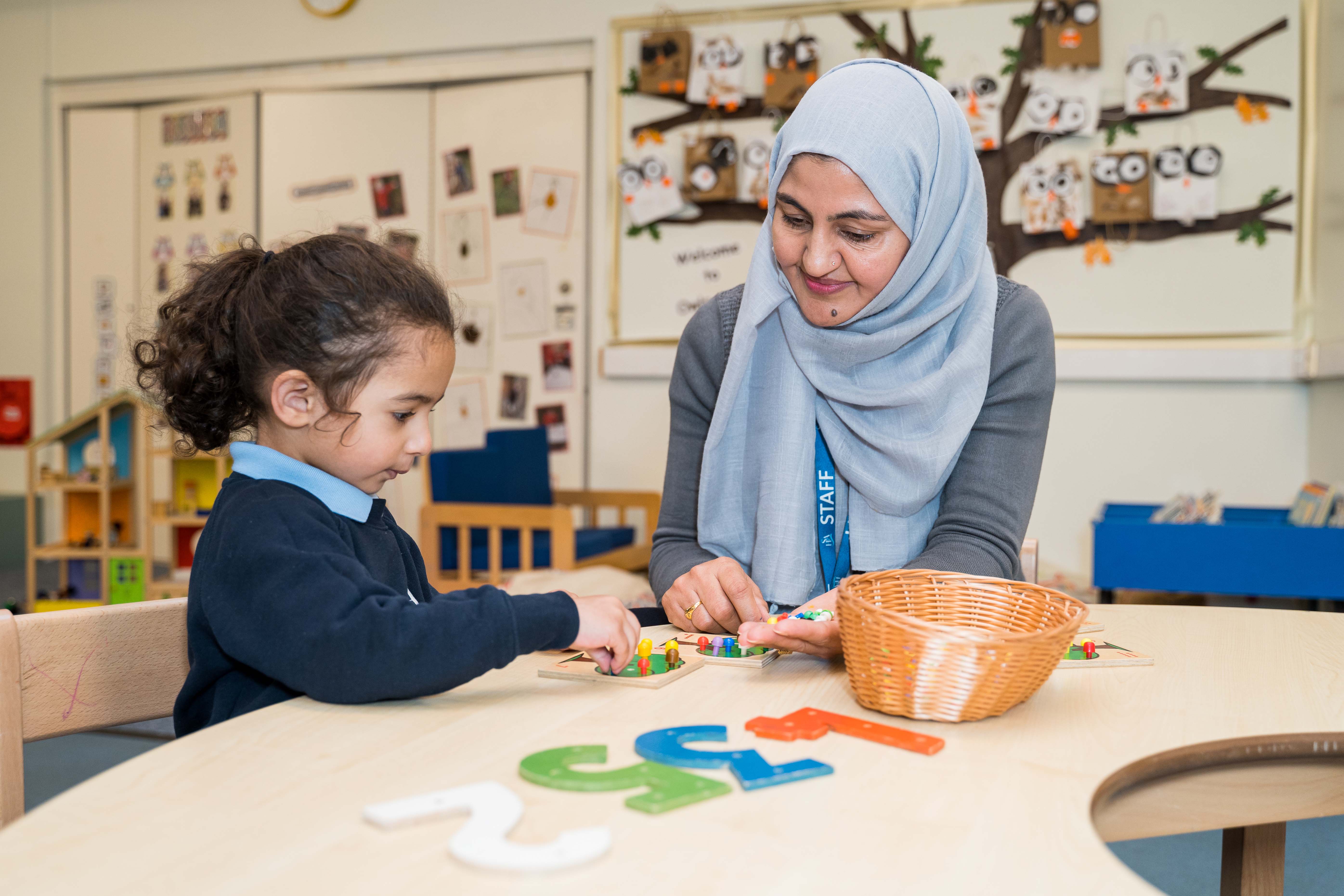 Pre-prep pupil and teaching assistant
