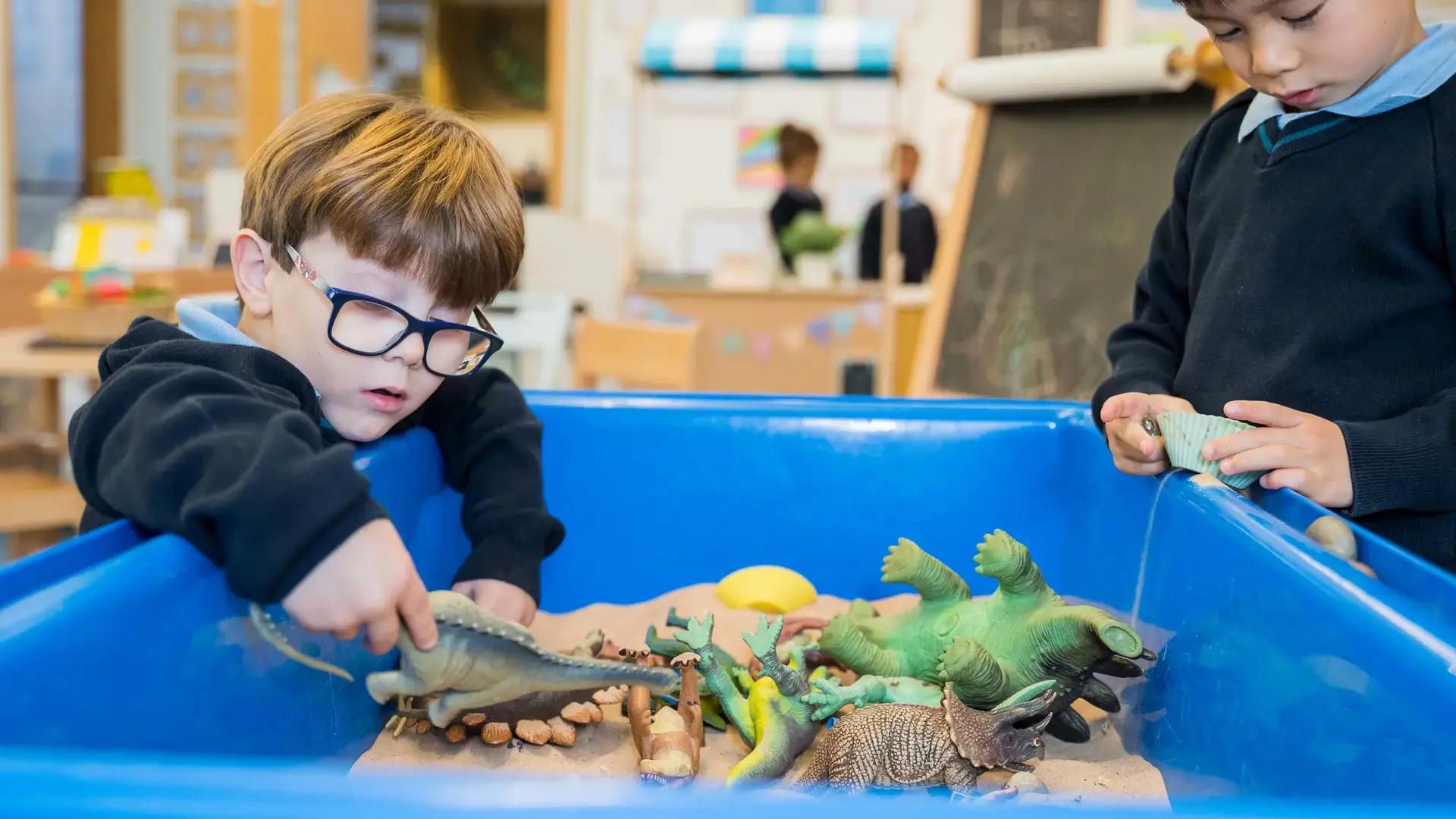 Student Playing in Sandbox
