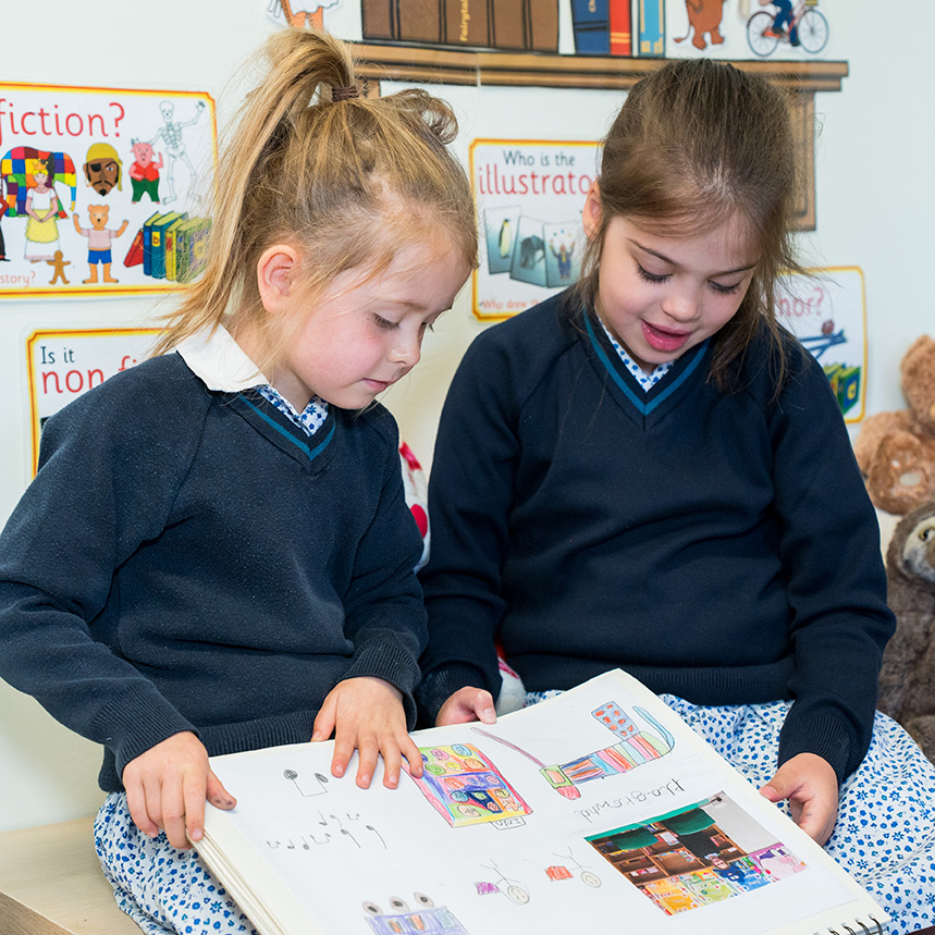 Two girls in book corner